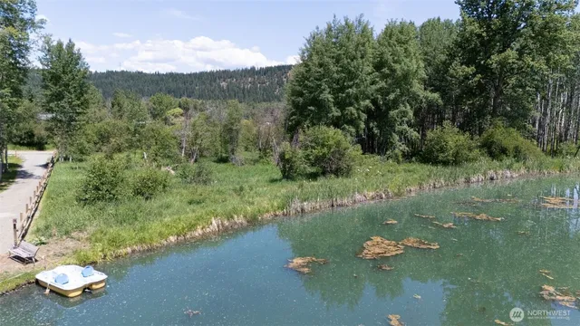 a view of a lake with a yard