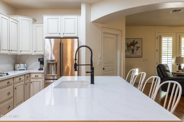 a white bath tub sitting in a bathroom next to a window