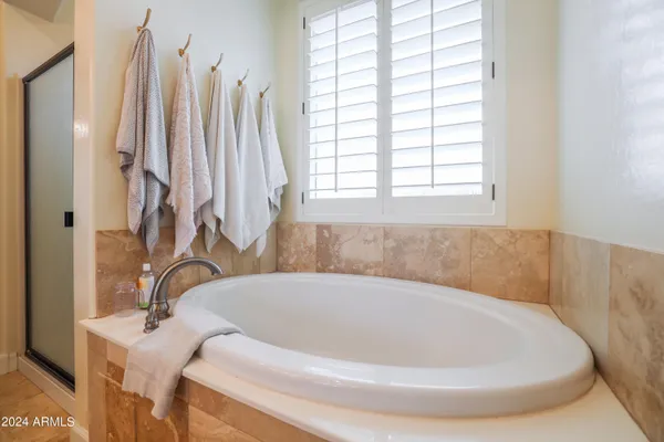 a view of a chair and table in the back yard