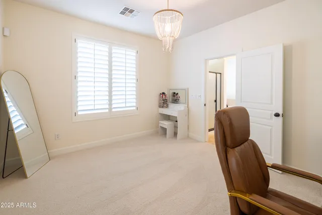 a view of a house with pool and chairs