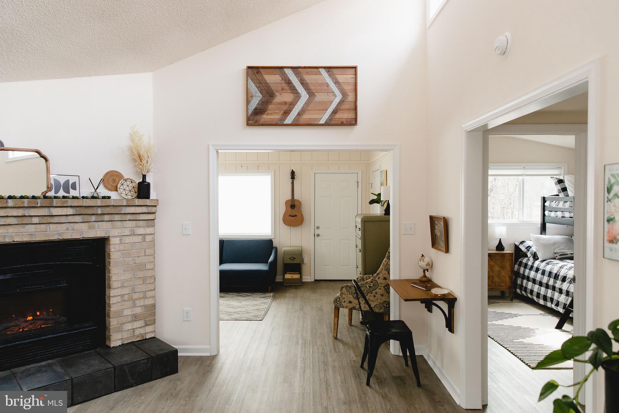 331 Walden Road Hedgesville, WV 25427 - Photo 12 of 30 a living room with furniture and a fireplace