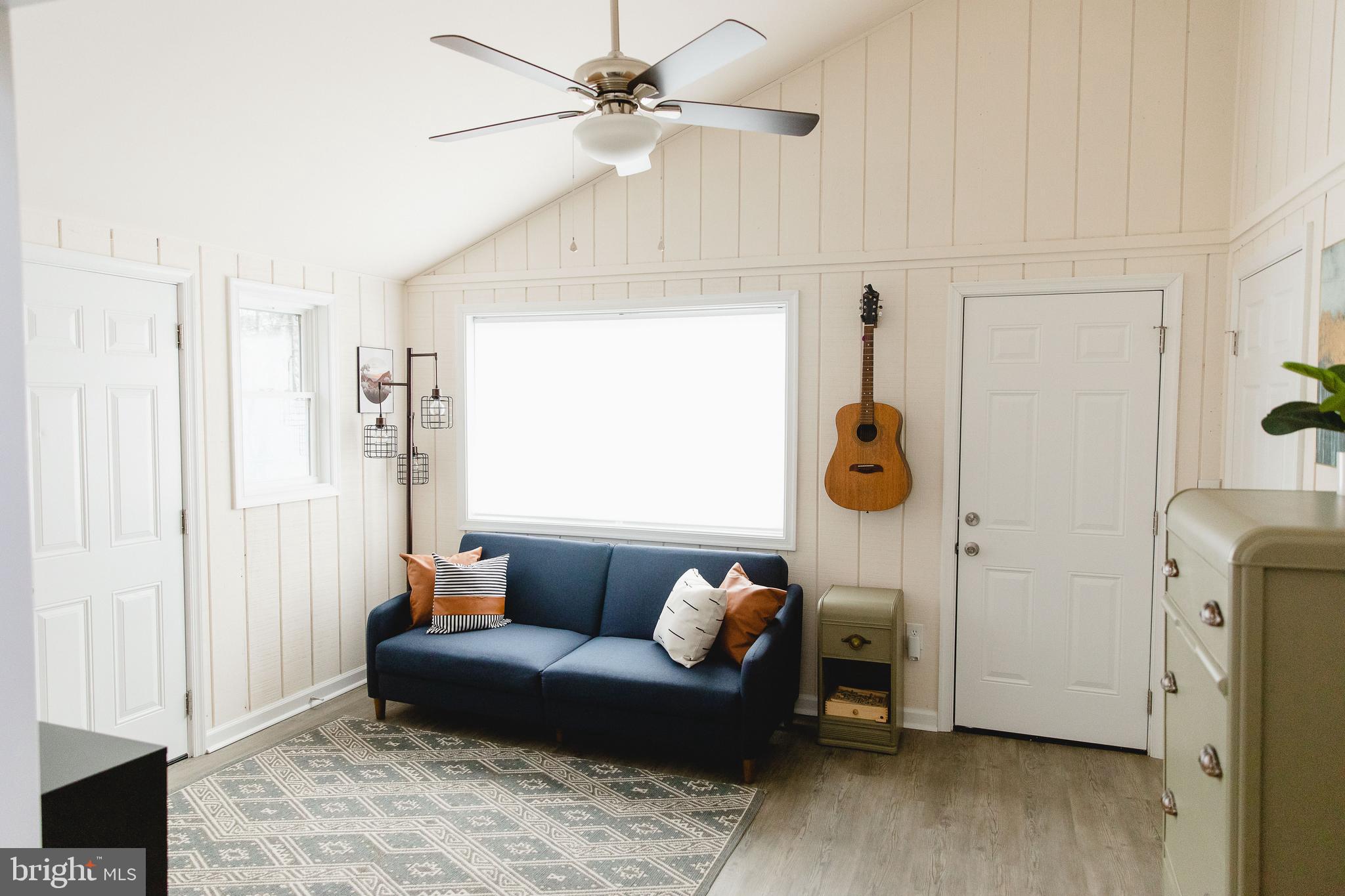 331 Walden Road Hedgesville, WV 25427 - Photo 14 of 30 a living room with furniture and a window