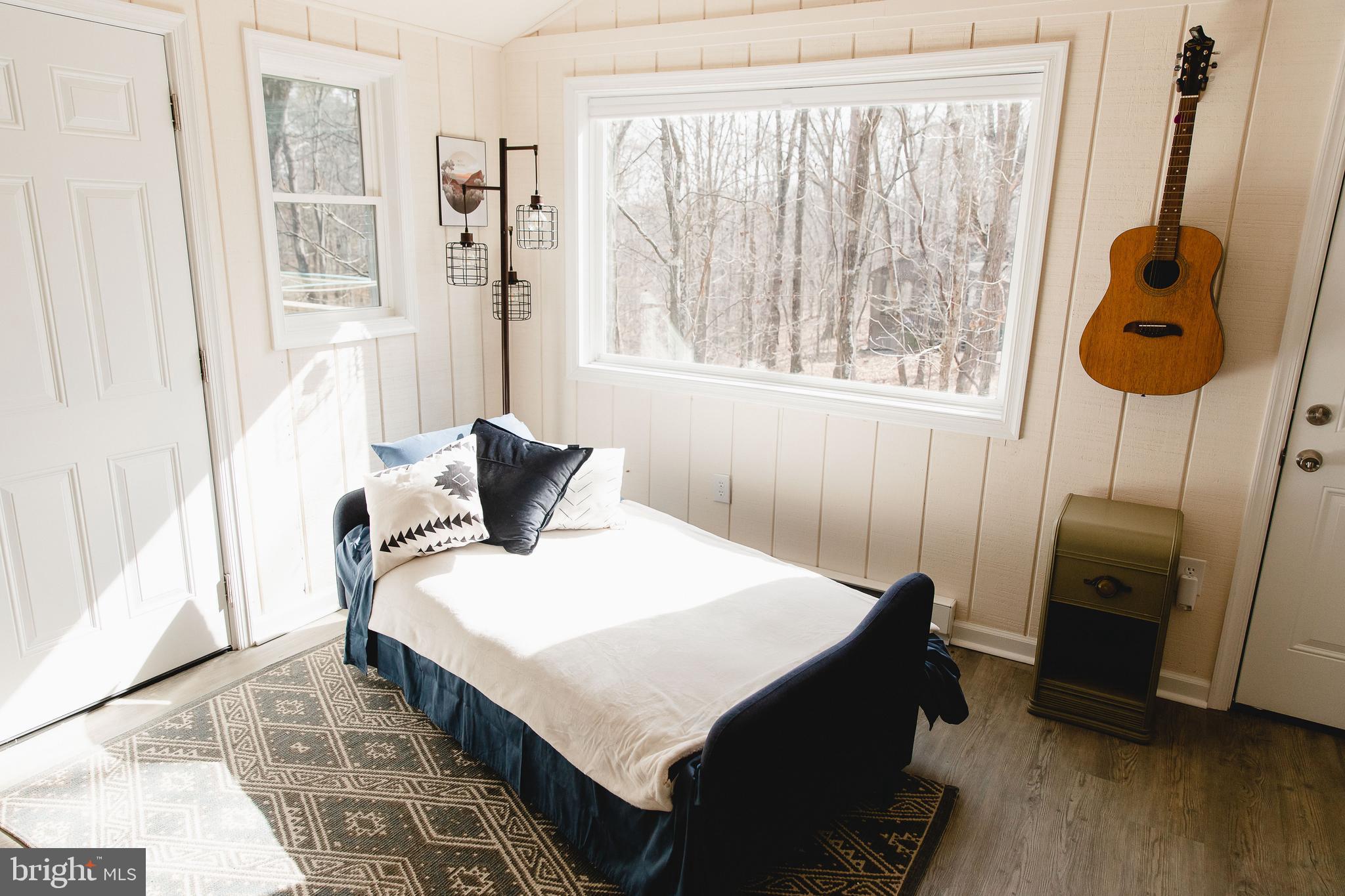 331 Walden Road Hedgesville, WV 25427 - Photo 15 of 30 a bedroom with a bed and a window