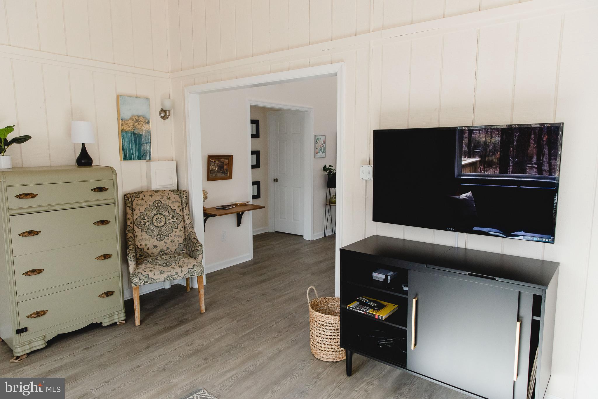 331 Walden Road Hedgesville, WV 25427 - Photo 16 of 30 a living room with furniture and a flat screen tv