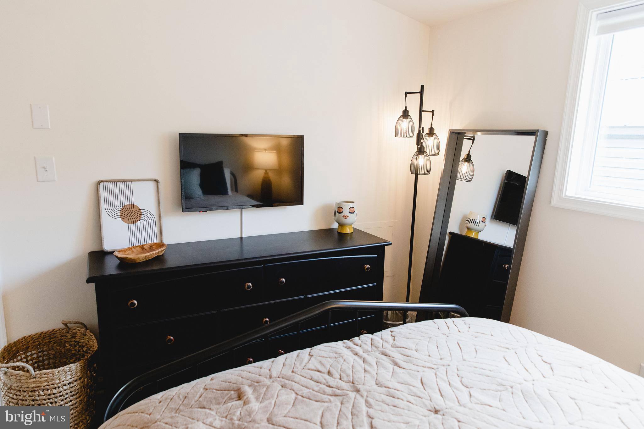 331 Walden Road Hedgesville, WV 25427 - Photo 19 of 30 a bedroom with a bed and a flat screen tv