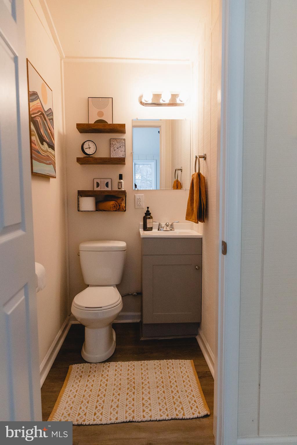 331 Walden Road Hedgesville, WV 25427 - Photo 20 of 30 a bathroom with a toilet a sink and a mirror