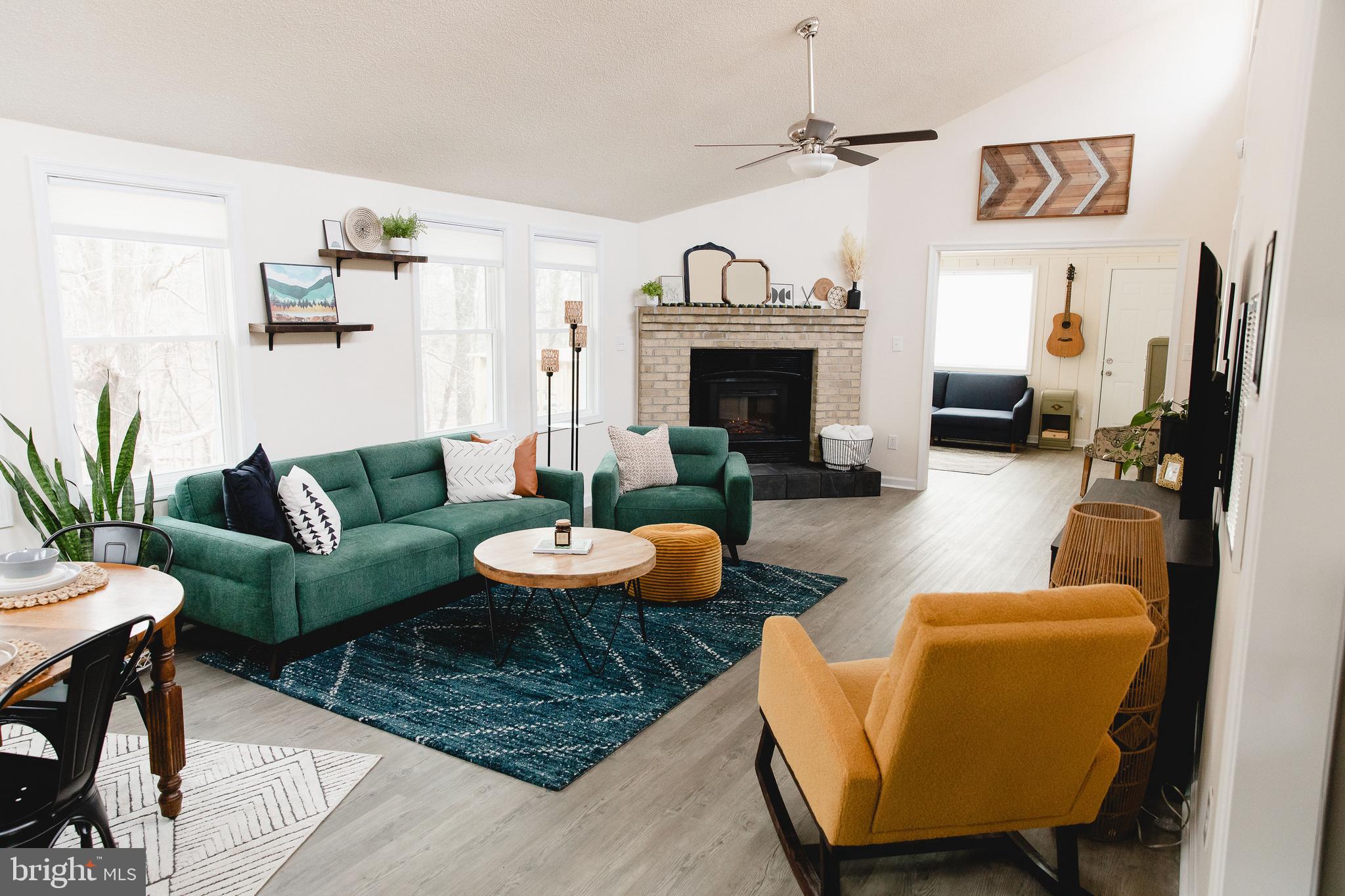 331 Walden Road Hedgesville, WV 25427 - Photo 2 of 30 a living room with furniture and a fireplace