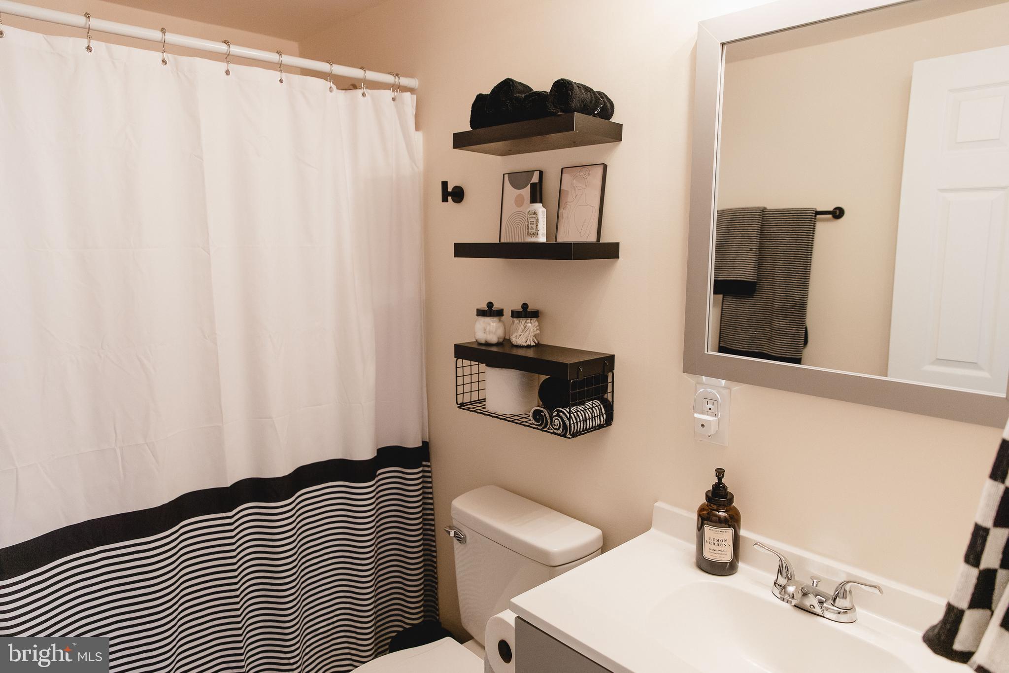 331 Walden Road Hedgesville, WV 25427 - Photo 23 of 30 a bathroom with a sink and a mirror