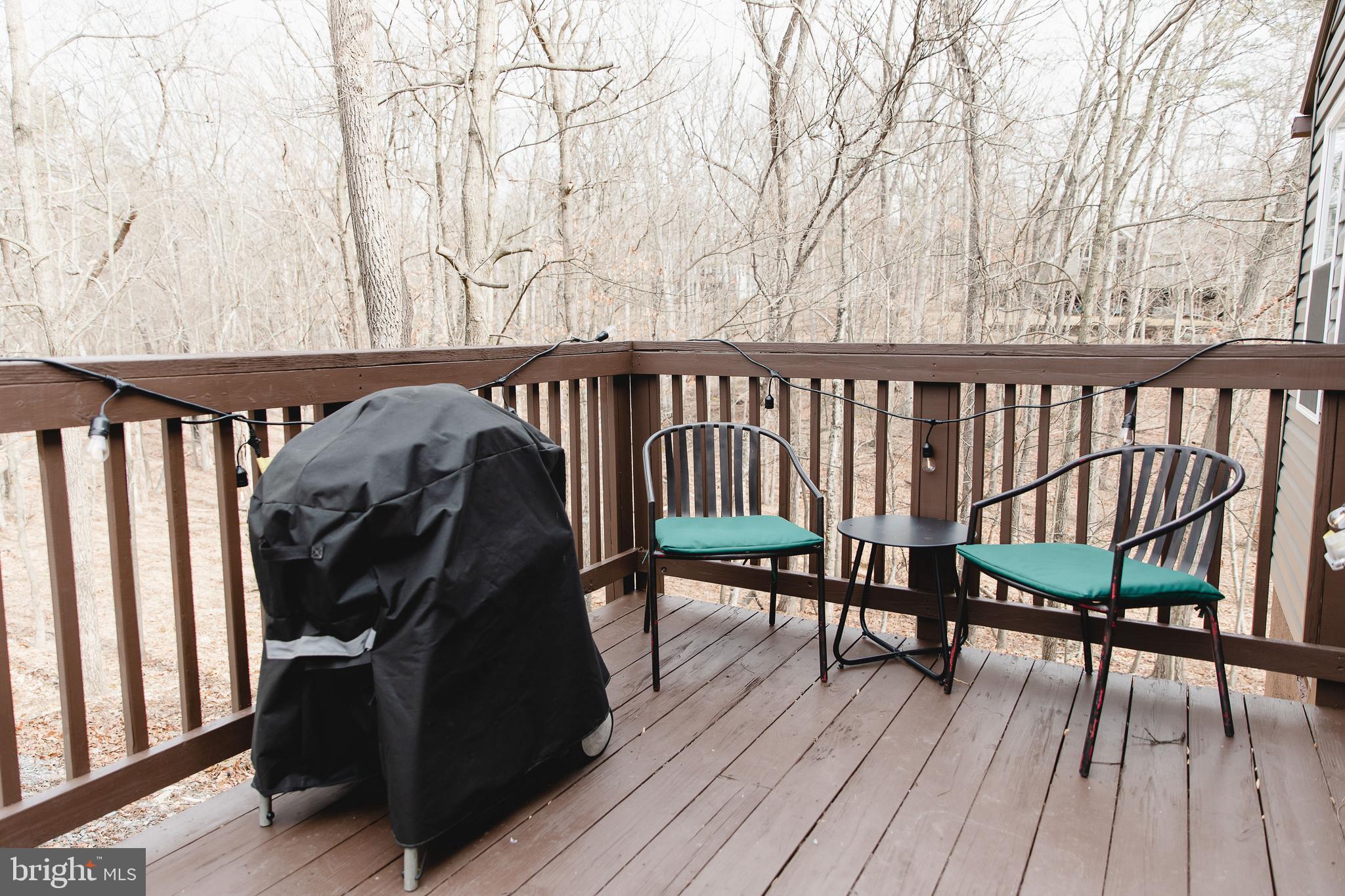 331 Walden Road Hedgesville, WV 25427 - Photo 24 of 30 a view of balcony with wooden floor and bench