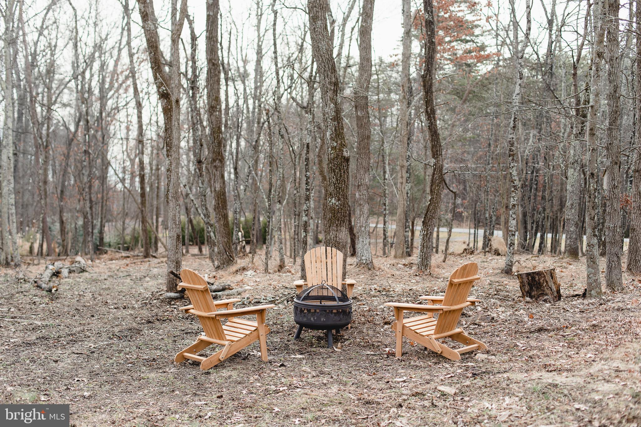 331 Walden Road Hedgesville, WV 25427 - Photo 25 of 30 a view of a patio with a table and chairs