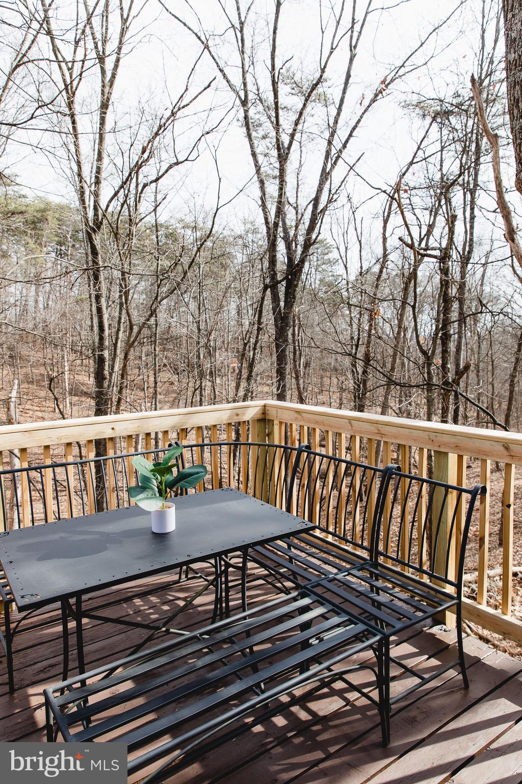 331 Walden Road Hedgesville, WV 25427 - Photo 26 of 30 a view of a chairs and table on the deck