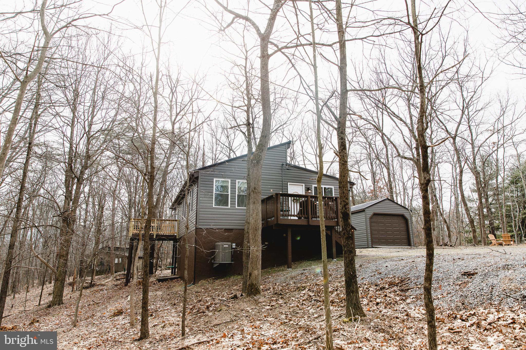 331 Walden Road Hedgesville, WV 25427 - Photo 30 of 30 a view of a house with a yard covered in snow
