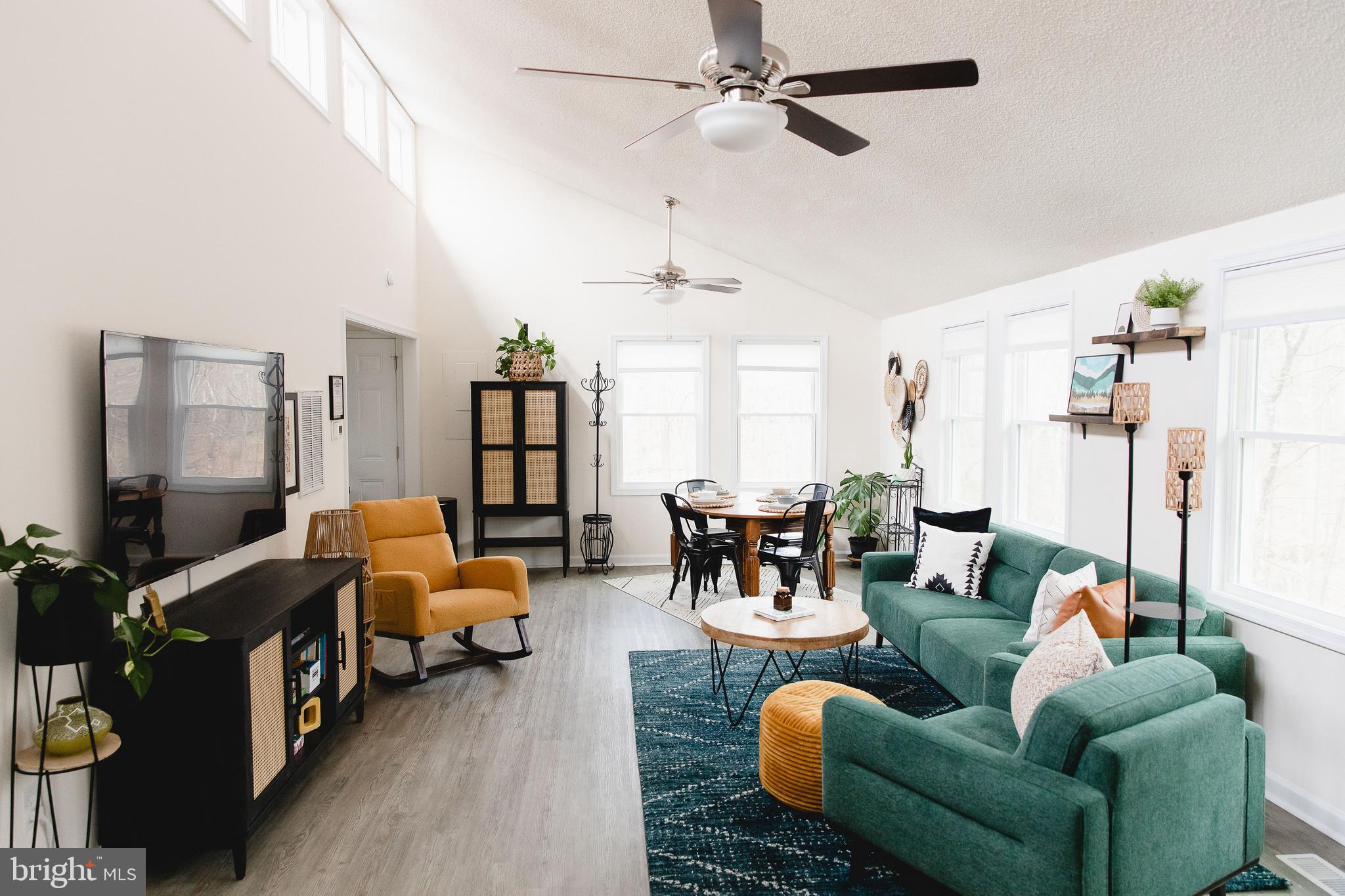 331 Walden Road Hedgesville, WV 25427 - Photo 5 of 30 a living room with furniture and a flat screen tv