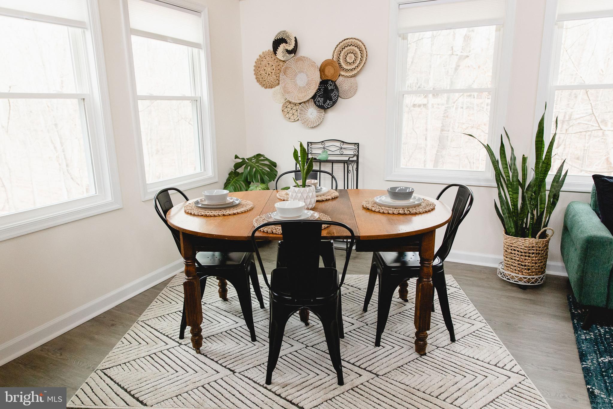 331 Walden Road Hedgesville, WV 25427 - Photo 6 of 30 a dining room with furniture a rug and a window