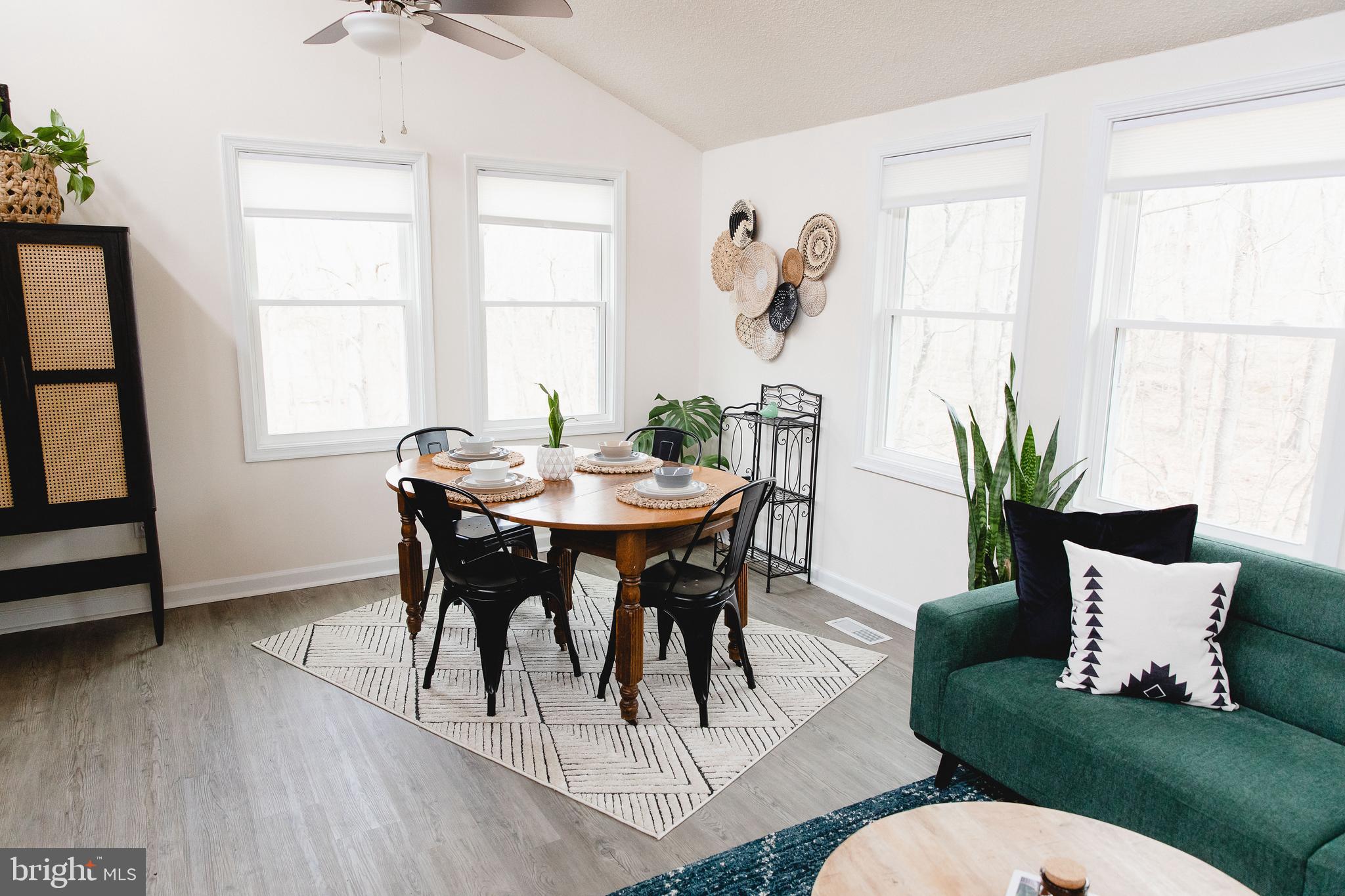 331 Walden Road Hedgesville, WV 25427 - Photo 7 of 30 a view of a dining room with furniture window and wooden floor