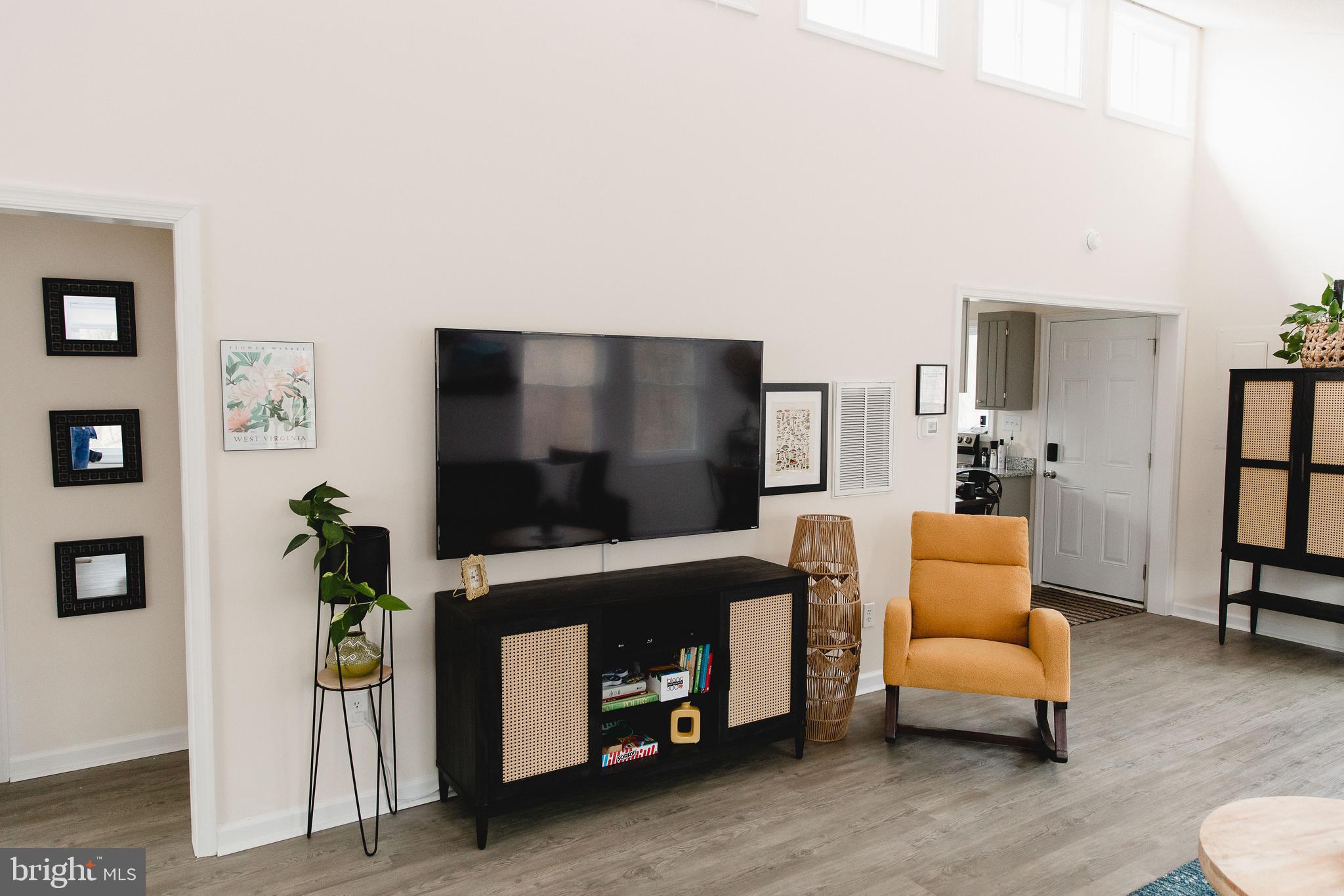 331 Walden Road Hedgesville, WV 25427 - Photo 8 of 30 a living room with furniture and a flat screen tv