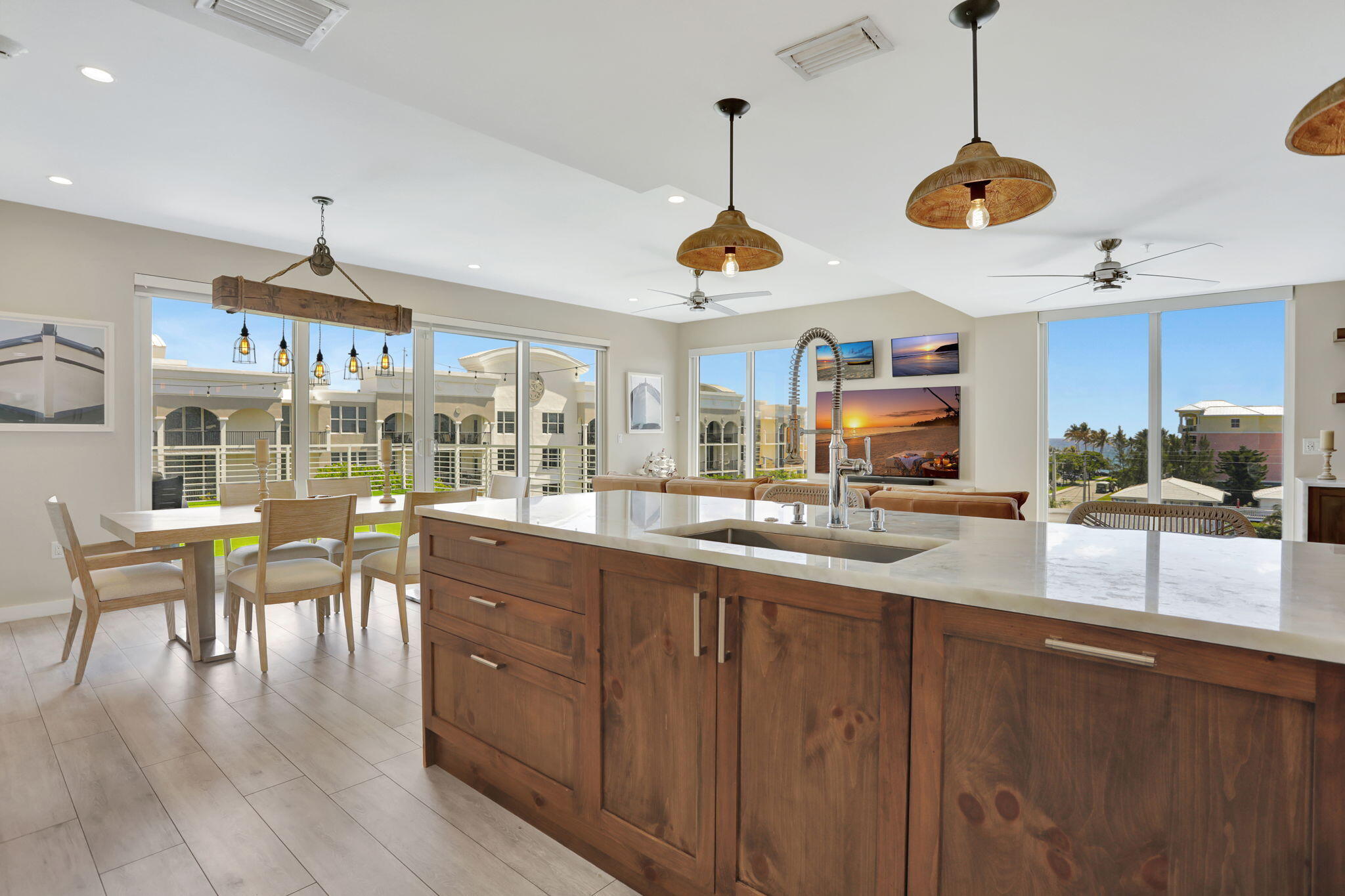 1900 Southeast 2nd Street, Unit 501 Deerfield Beach, FL 33441 - Photo 13 of 41 a kitchen with stainless steel appliances granite countertop wooden floors and white cabinets