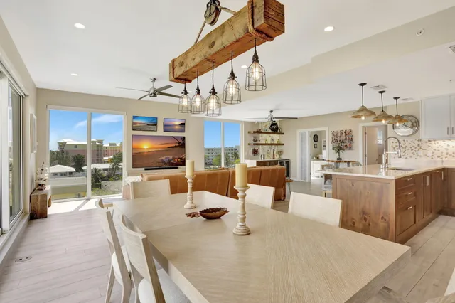 a large kitchen with a table and chairs