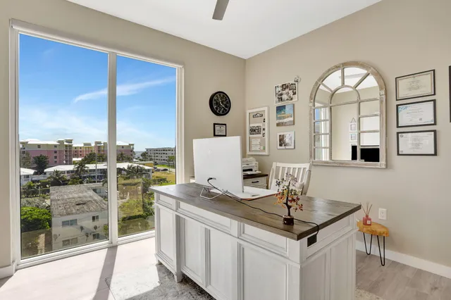 a view of a kitchen with living room and microwave