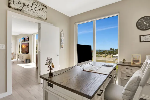 a living room with a table and a flat screen tv