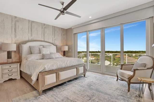 a bedroom with a bed chair and window