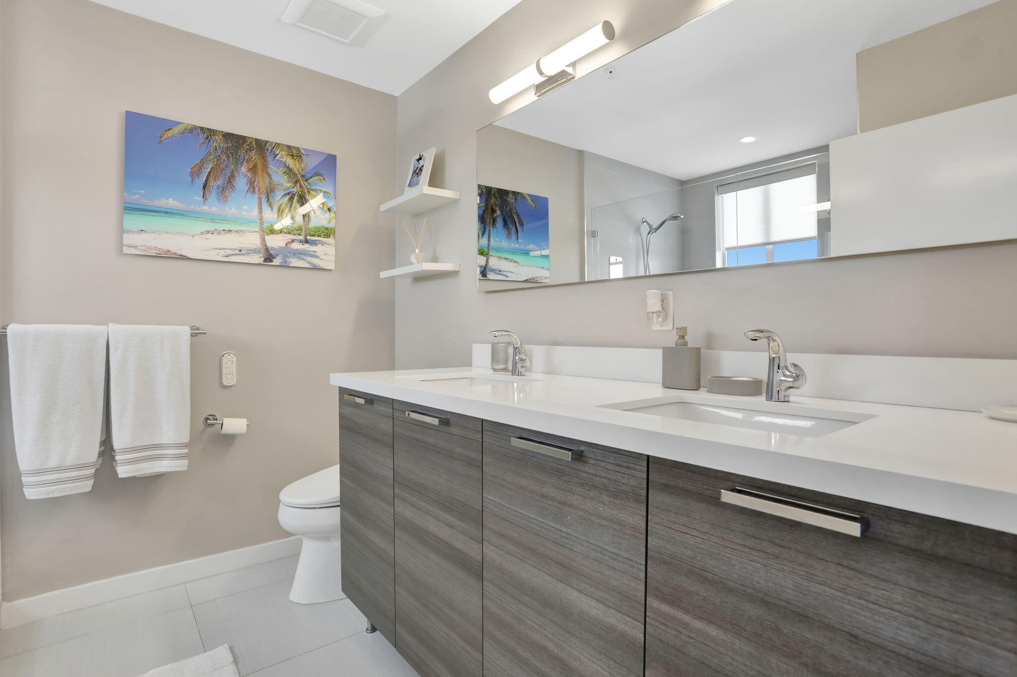 1900 Southeast 2nd Street, Unit 501 Deerfield Beach, FL 33441 - Photo 22 of 41 a bathroom with a double vanity sink and a mirror