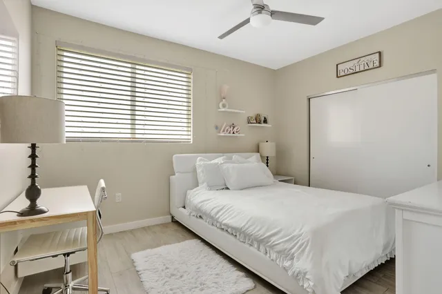 a bedroom with a bed and a table