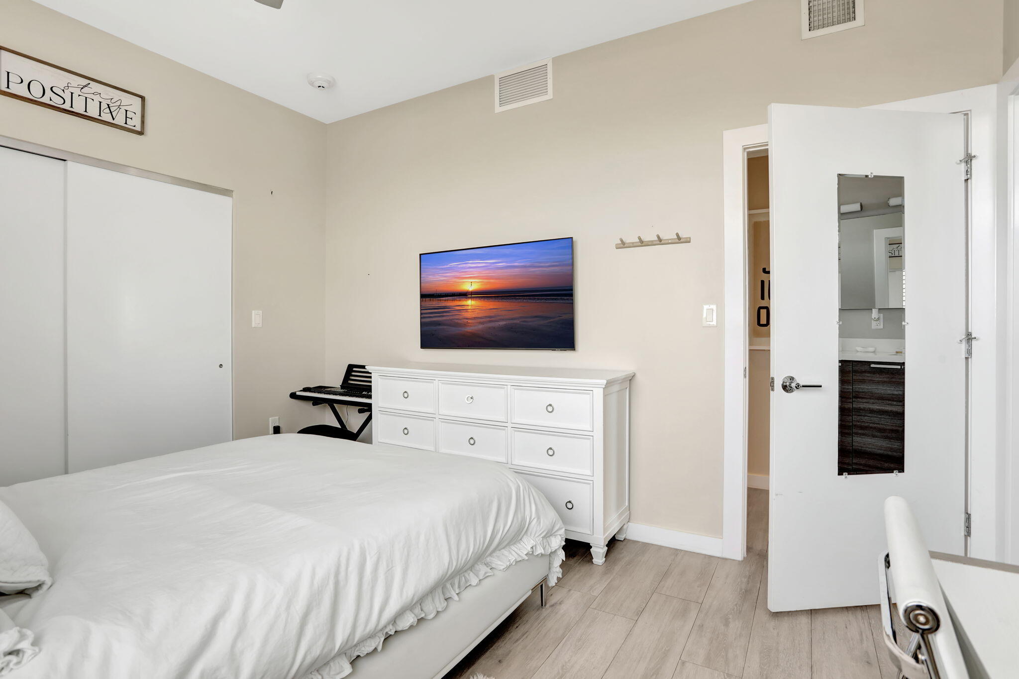 1900 Southeast 2nd Street, Unit 501 Deerfield Beach, FL 33441 - Photo 26 of 41 a bedroom with a bed and a flat screen tv