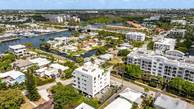 an aerial view of residential building and lake