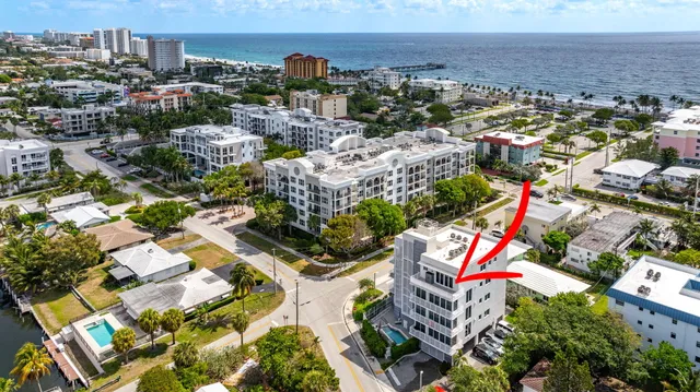 an aerial view of residential houses with city view
