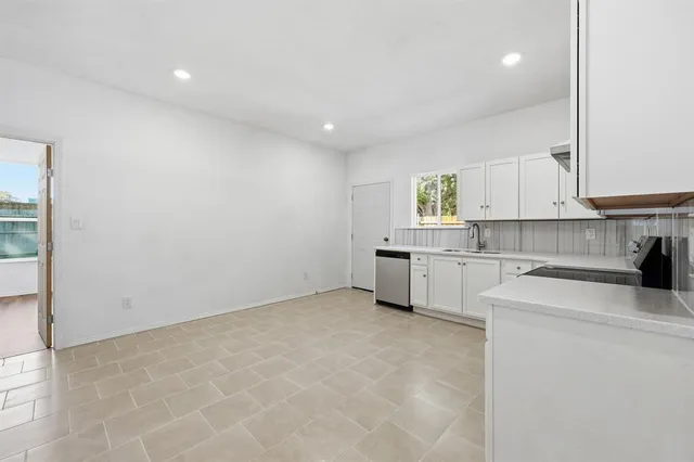 a view of a kitchen with electric appliances