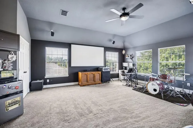 a bed room with furniture and a large window
