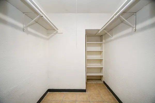 a view of an empty walk in closet