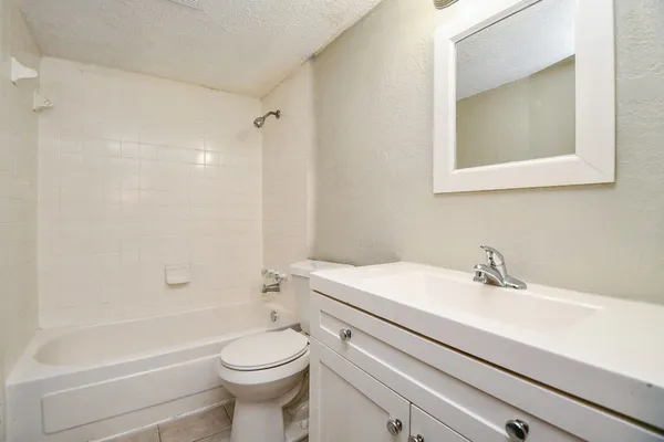 a bathroom with a sink a toilet and a bathtub
