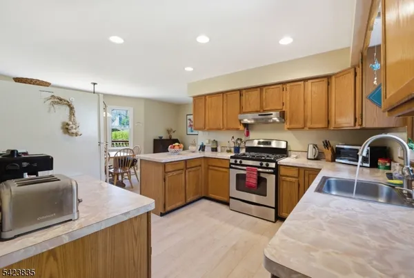 a view of a cabinet and a book shelf