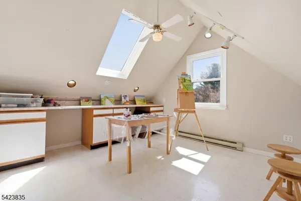 a room with a sink and a book shelf