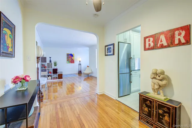 a kitchen with stainless steel appliances furniture stove and refrigerator