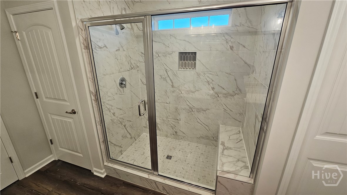 109 Classic Drive Pooler, GA 31322 - Photo 11 of 28 Tile Shower with Bench Seat in Primary Bathroom