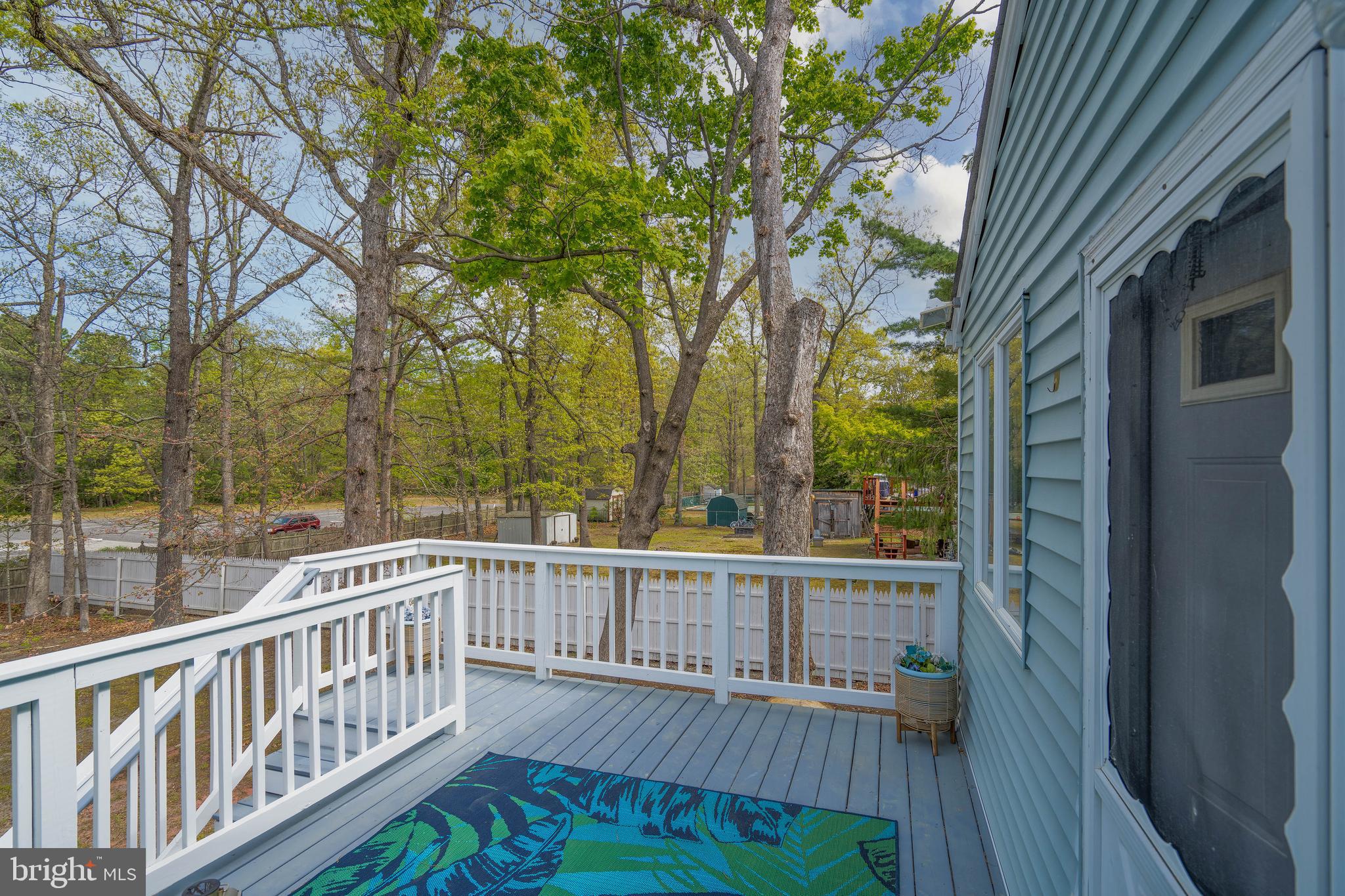 7 Briarcliff Road Atco, NJ 08004 - Photo 28 of 37 a view of a wooden deck and a yard with wooden fence