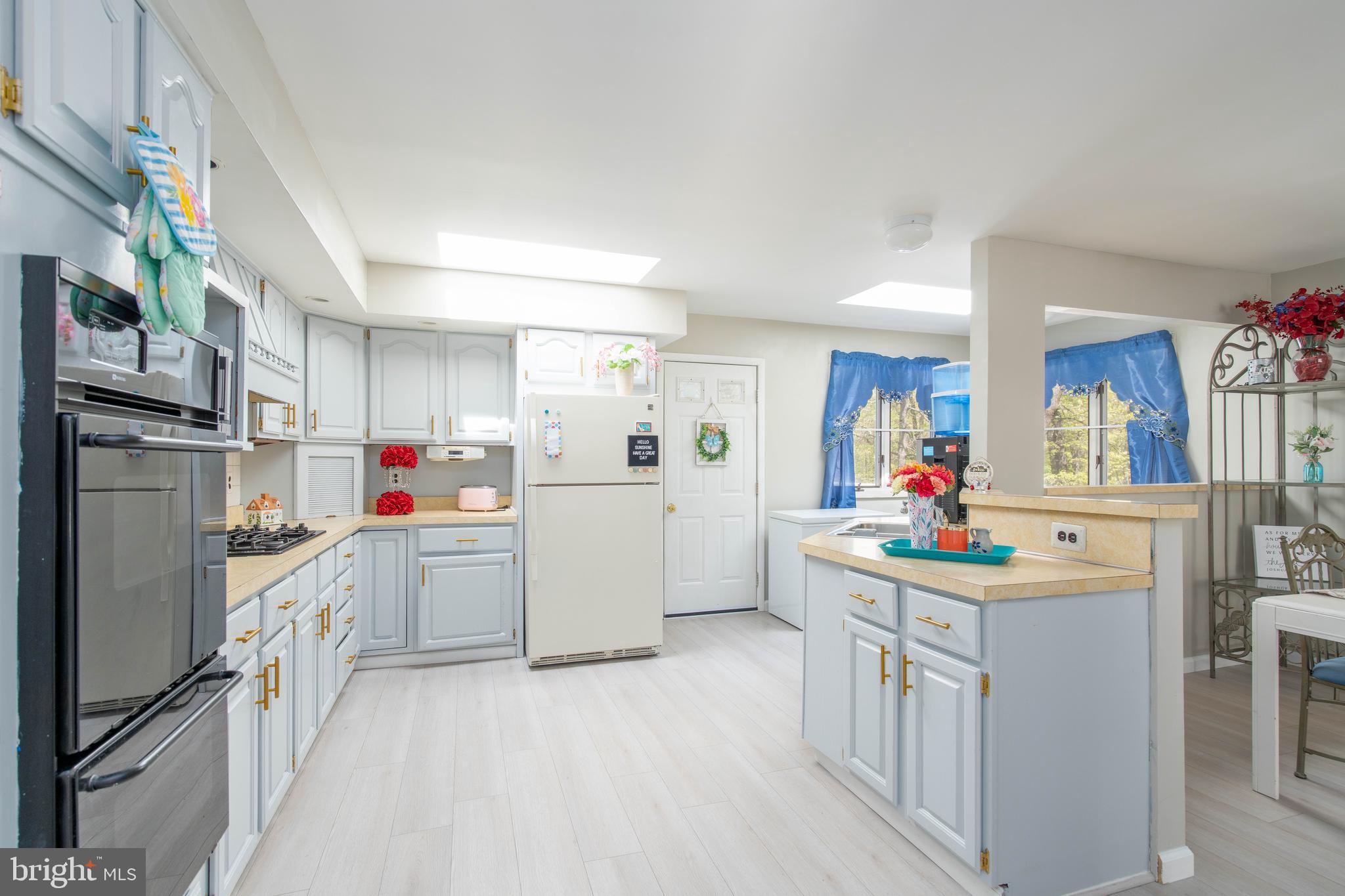 7 Briarcliff Road Atco, NJ 08004 - Photo 7 of 37 a kitchen with refrigerator and cabinets