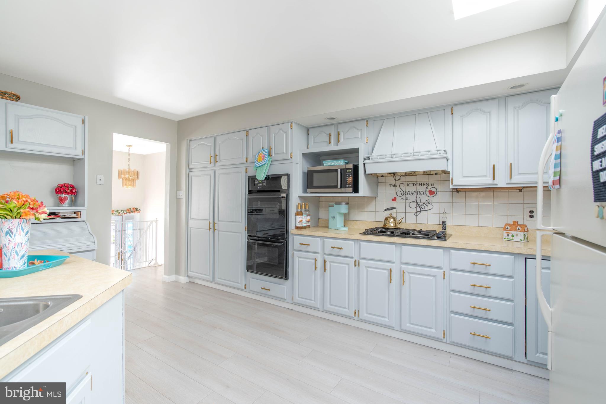 7 Briarcliff Road Atco, NJ 08004 - Photo 9 of 37 a kitchen with granite countertop white cabinets and stainless steel appliances