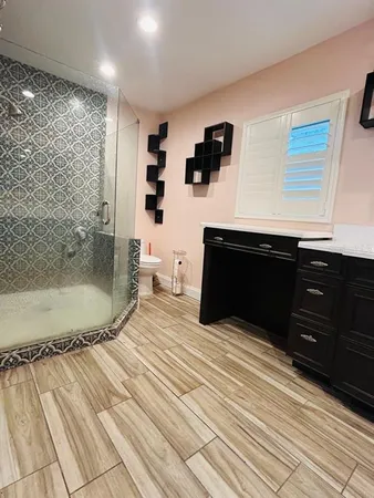 a spacious bathroom with a bathtub and a shower