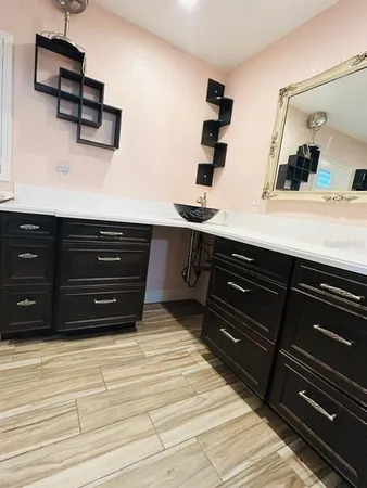 a room with a dresser and a mirror