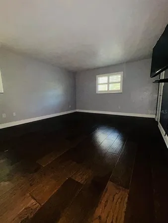 a view of an empty room with a window