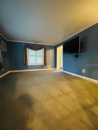 a view of empty room with windows