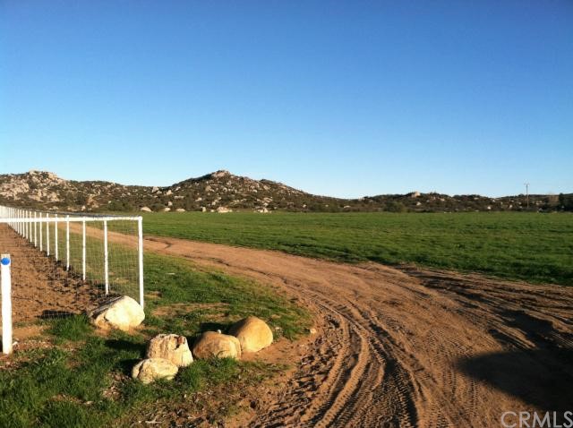 0 Juniper Hills Road Homeland, CA 92548 - Photo 1 of 1 FRONT CORNER VIEW. WHITE FENCE IS NEIGHBORS PROPERTY TO THE LEFT.