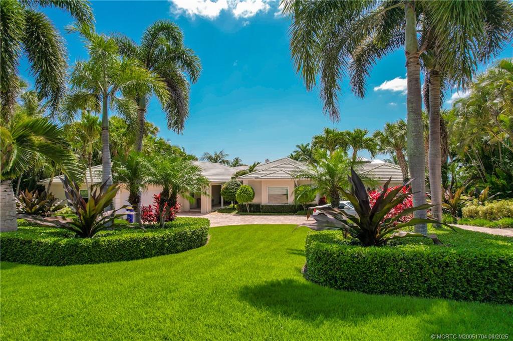 16 East High Point Road Sewall's Point, FL 34996 - Photo 10 of 40 a view of a garden with a building in the background