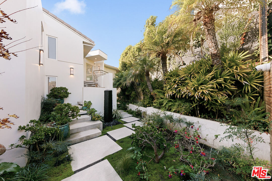 31558 Victoria Point Road Malibu, CA 90265 - Photo 8 of 55 a view of a garden with pathway