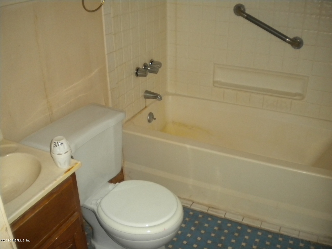 4766 Manchester Road Jacksonville, FL 32210 - Photo 8 of 10 a bathroom with a toilet and a shower