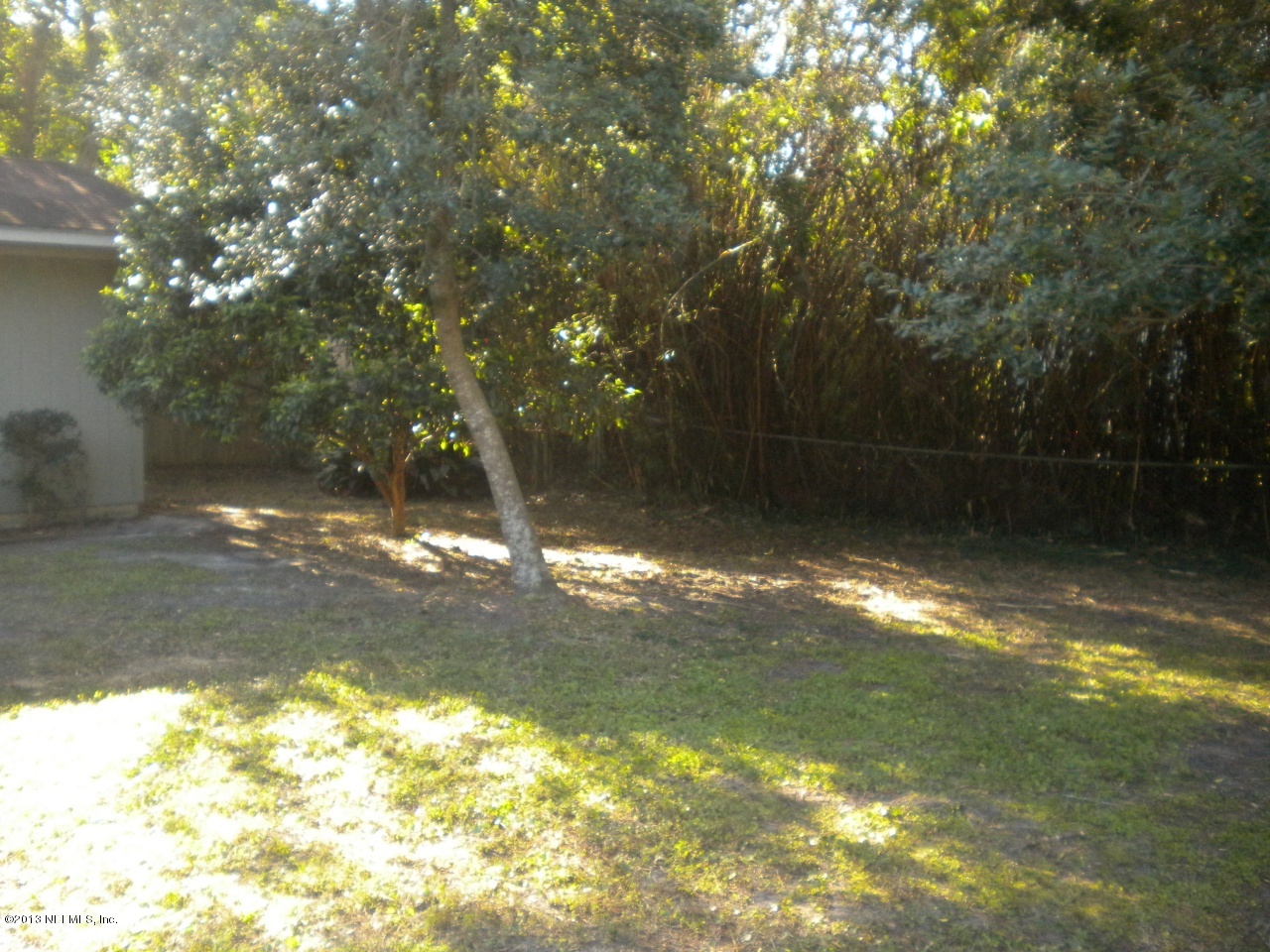 4766 Manchester Road Jacksonville, FL 32210 - Photo 10 of 10 a view of a yard with a tree